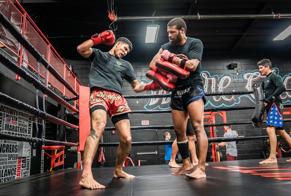 8 Tribe Muay Thai Logo