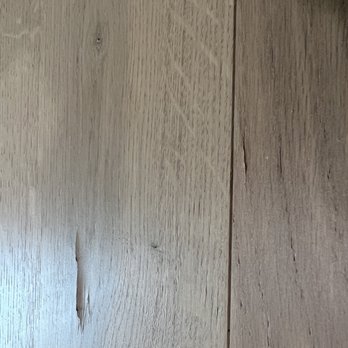 Stratus Building Solutions - Another example of damage caused to my brand new engineered wood floors due to the cleaners wet mopping. - Office Cleaning Near Me - Glendale, California