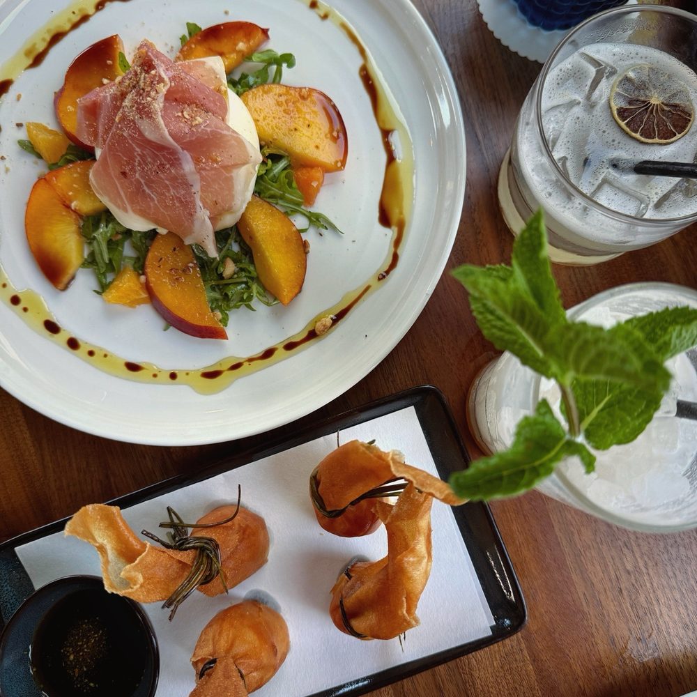 Lana - Peach burrata salad and shrimp egg rolls - American Near Me - Solana Beach, California