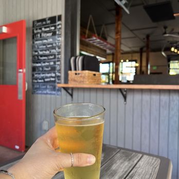 The Firehall Kitchen and Taphouse - White peach cider on the back patio - Cocktail Bars Near Me - La Conner, Washington The Firehall Kitchen and Taphouse - White peach cider on the back patio - Cocktail Bars Near Me - La Conner, Washington