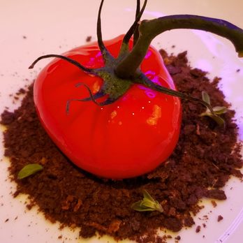 MAD - Tomato. It's not a real tomato and it's filled with cheese and pesto sauce. It was okay. - Spanish Near Me - Houston, Texas