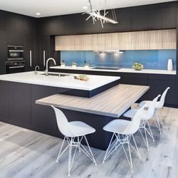 In N out Remodeling - Minimalist kitchen design by In N Out Remodeling, with clean lines, soft-close drawers, and a neutral palette.