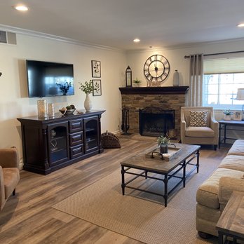 Floor Wurx - a living room with couches and a fireplace - Flooring Near Me Floor Wurx - a living room with couches and a fireplace - Flooring Near Me