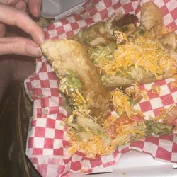 La Chula Mexican Bar And Grill - 5 Piece Rolled Tacos soggy and sitting in lettuce water...