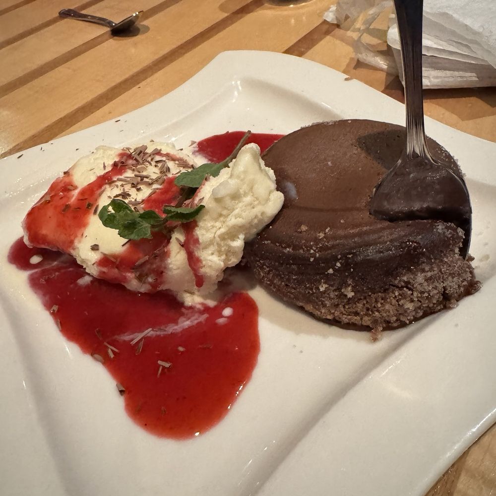 Anthony's Restaurant - Chocolate lava cake with vanilla ice cream and a raspberry drizzle. - Seafood Near Me - Olympia, Washington Anthony's Restaurant - Chocolate lava cake with vanilla ice cream and a raspberry drizzle. - Seafood Near Me - Olympia, Washington