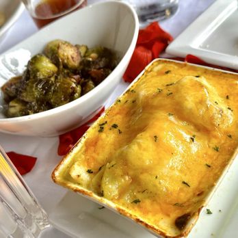 Ruth's Chris Steakhouse - Sides: Brussel sprouts and Au Gratin - Steakhouses Near Me - Asheville, North Carolina Ruth's Chris Steakhouse - Sides: Brussel sprouts and Au Gratin - Steakhouses Near Me - Asheville, North Carolina