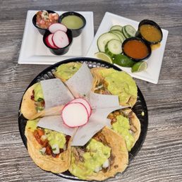 Delicious taco plate. I tried them all. They were all delicious. Combined with the house salsas they were great. Delicious taco plate. I tried them all. They were all delicious. Combined with the house salsas they were great.