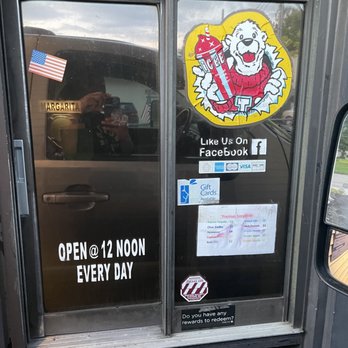 Daquiris To Go - an open window with stickers on it - Beverage Store Near Me - Alexandria, Louisiana Daquiris To Go - an open window with stickers on it - Beverage Store Near Me - Alexandria, Louisiana