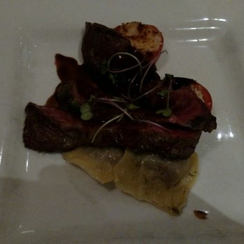 West Coast Grill - Wagyu Beef - Seared flank, grilled tomamto, cheek and froie gras ravioli, barbera rosemary reduction - American Near Me - Sooke, British Columbia