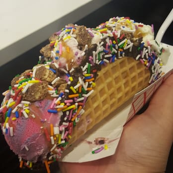 Booyah - Icecream Taco with Cotton Candy, Black Raspberry Thunder and Vanilla icecream. Covered in caramel sauce and sprinkles and kit kat pieces. - Desserts Near Me - Toronto, Ontario Booyah - Icecream Taco with Cotton Candy, Black Raspberry Thunder and Vanilla icecream. Covered in caramel sauce and sprinkles and kit kat pieces. - Desserts Near Me - Toronto, Ontario
