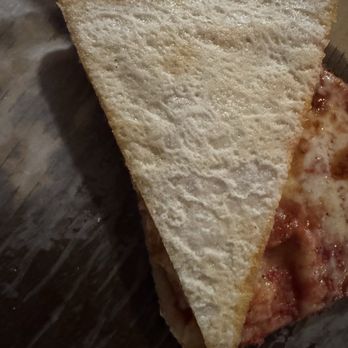 Lindos Pizza - Bottom of slice of pizza. Not fully cooked. Doughy between "crust" and sauce. - Pizza Near Me - South Easton, Massachusetts Lindos Pizza - Bottom of slice of pizza. Not fully cooked. Doughy between "crust" and sauce. - Pizza Near Me - South Easton, Massachusetts