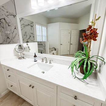 Premier Magnolia Homes - Double vanity bathroom remodel with quartz countertop, white shaker cabinets, and frameless mirror -- Premier Magnolia Homes, Naples FL - General Contractors Near Me - Naples, Florida Premier Magnolia Homes - Double vanity bathroom remodel with quartz countertop, white shaker cabinets, and frameless mirror -- Premier Magnolia Homes, Naples FL - General Contractors Near Me - Naples, Florida