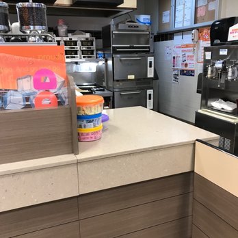 Dunkin' - a kitchen with a counter, oven, and refrigerator - Coffee & Tea Near Me - Brooklyn, New York Dunkin' - a kitchen with a counter, oven, and refrigerator - Coffee & Tea Near Me - Brooklyn, New York