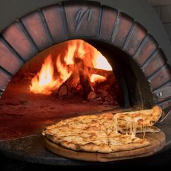 The Firewood Depot - How delicious it is to have a bite of firewood oven pizza!