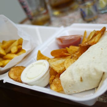 Wings Olé - a burrito and chips in a styrofoam container - Mexican Near Me - Morgantown, West Virginia Wings Olé - a burrito and chips in a styrofoam container - Mexican Near Me - Morgantown, West Virginia