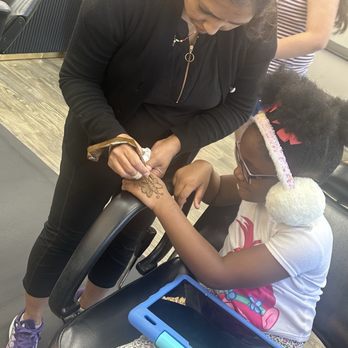 Sandy's Threading & Beauty - Gigi painting a butterfly on my daughter which - Threading Services Near Me - Houston, Texas Sandy's Threading & Beauty - Gigi painting a butterfly on my daughter which - Threading Services Near Me - Houston, Texas