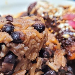 Soto's Cantina - Enchiladas Mole with the special rice and banana!