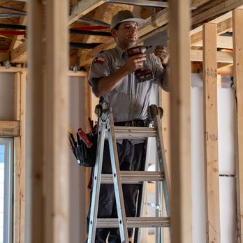JRV Home Services - Field technician working on HVAC system and air distribution box. - Heating & Air Conditioning/HVAC Near Me - San Antonio, Texas JRV Home Services - Field technician working on HVAC system and air distribution box. - Heating & Air Conditioning/HVAC Near Me - San Antonio, Texas