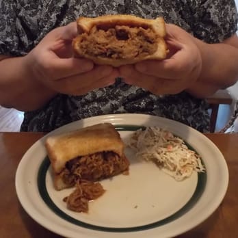 Snack Shack - a man holding a pulled pork sandwich - Barbeque Near Me - Rising Sun, Indiana Snack Shack - a man holding a pulled pork sandwich - Barbeque Near Me - Rising Sun, Indiana