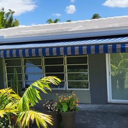 Harrison Awnings - 20' Wide x 10' Projection SunPro Brand retractable awning in bronze frame with custom Sunbrella fabric