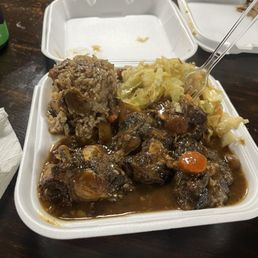 Oxtails, cabbage, rice and peas Oxtails, cabbage, rice and peas