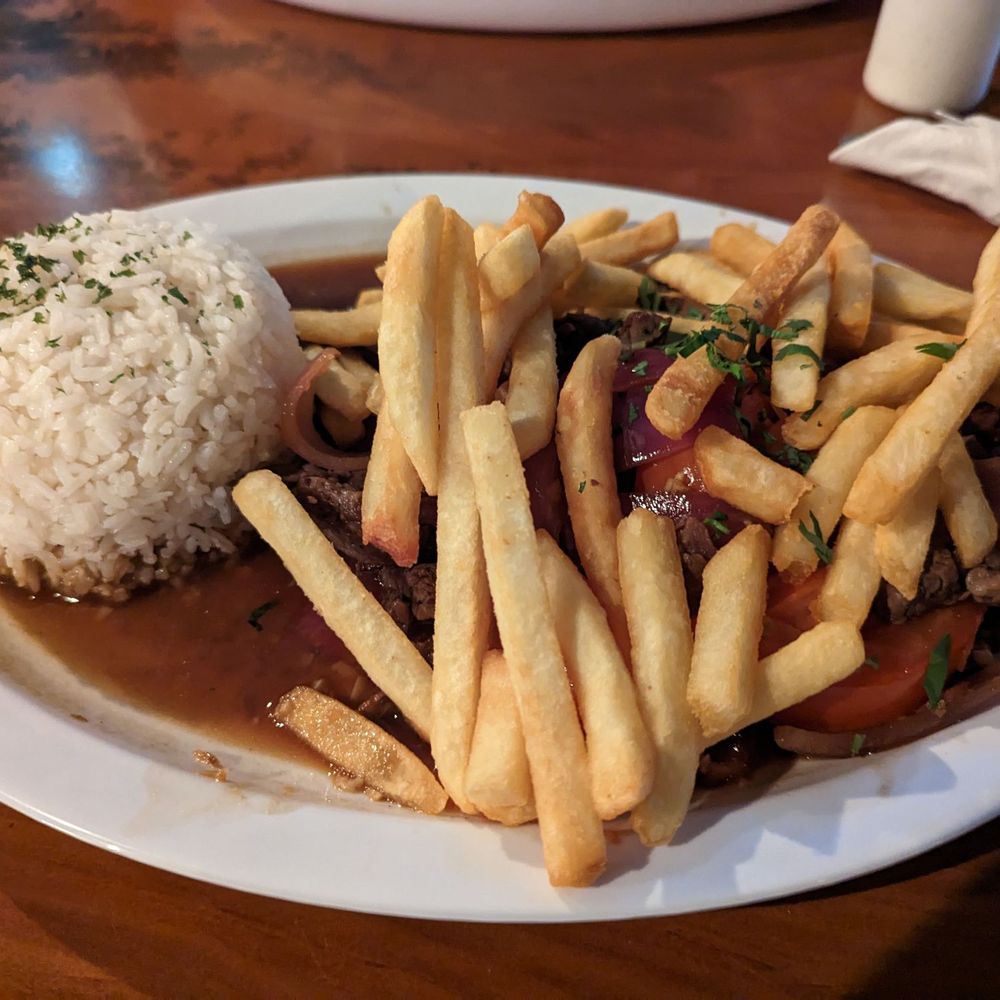 Pio Pio Latin Cuisine - Lomo Saltado - Peruvian Near Me - Orlando, Florida Pio Pio Latin Cuisine - Lomo Saltado - Peruvian Near Me - Orlando, Florida
