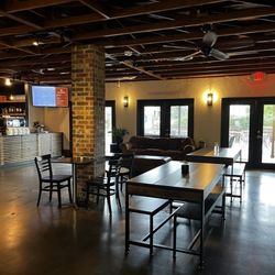 Moravian Coffee - Inside ordering area with tables The outside patio area just past doors