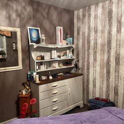 Heartsong Wellness - Cozy treatment room from another angle... Amazing products are on display and available to order.