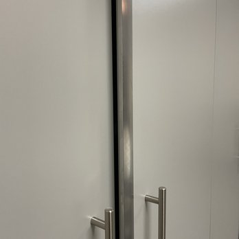 Garage & Closet Kingdom - a stainless steel door and handle - General Contractors Near Me - Indio, California Garage & Closet Kingdom - a stainless steel door and handle - General Contractors Near Me - Indio, California