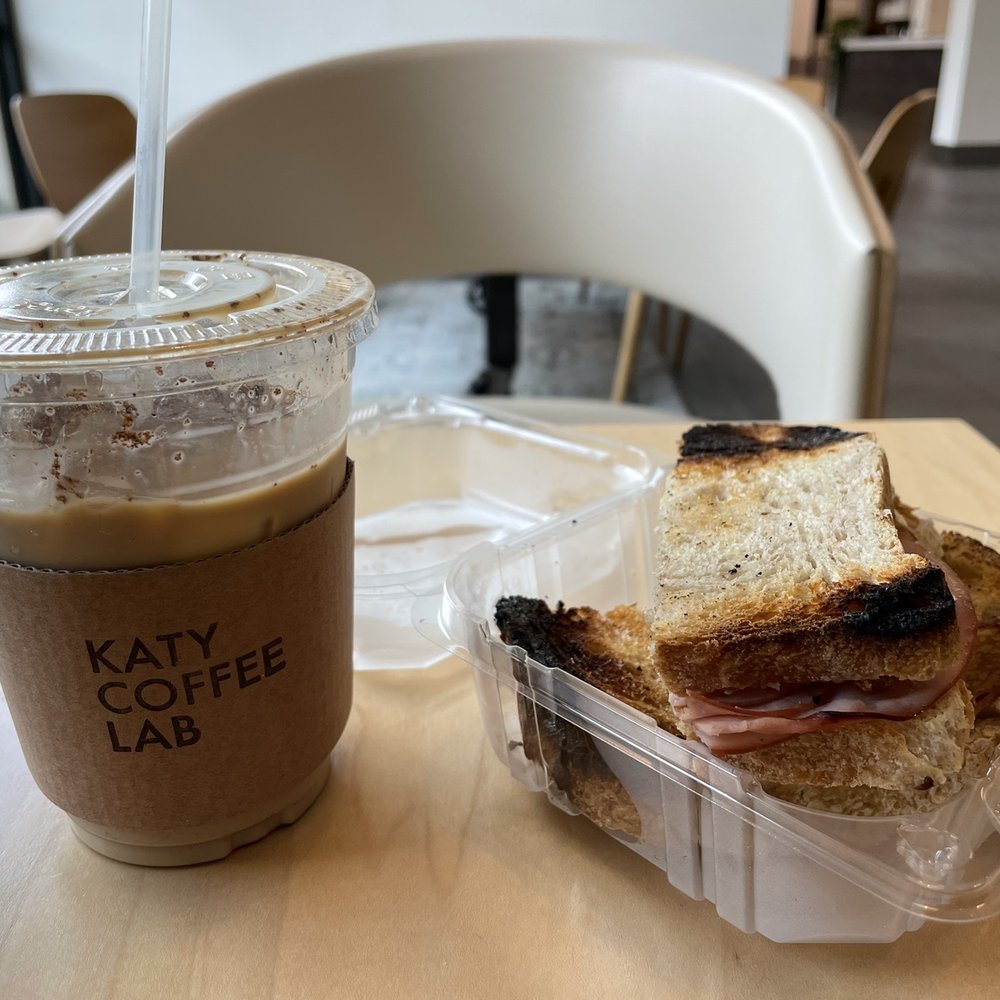 Katy Coffee Lab - Iced VGL and the sandwich except they burnt it - Coffee & Tea Near Me - Dallas, Texas Katy Coffee Lab - Iced VGL and the sandwich except they burnt it - Coffee & Tea Near Me - Dallas, Texas