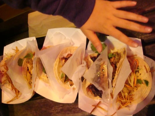 Photo of Tako Truk - Seattle, WA, US. the tacos are small, on the first plate there are 3