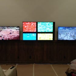 DB Cinematic - Triple TV install, using a pair of Sony 55" LED TVs on either side of a Sony XBR 75" LED TV. All controlled by universal remote.