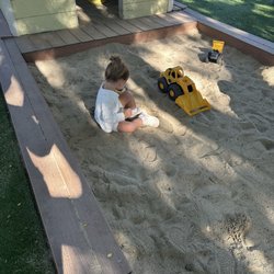Grandview House Preschool - Huge sand box and play house.