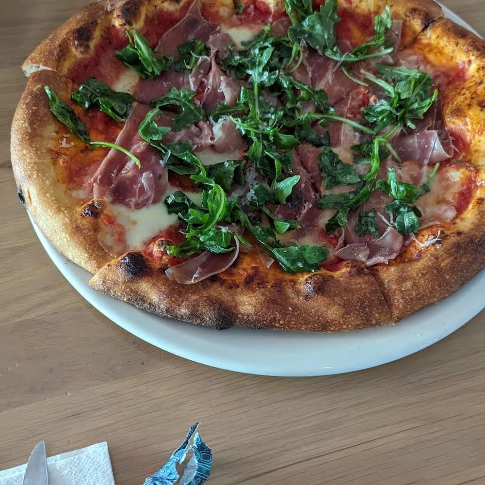 Earls Kitchen + Bar - Prosciutto and arugula pizza - Canadian (New) Near Me - Vancouver, British Columbia Earls Kitchen + Bar - Prosciutto and arugula pizza - Canadian (New) Near Me - Vancouver, British Columbia