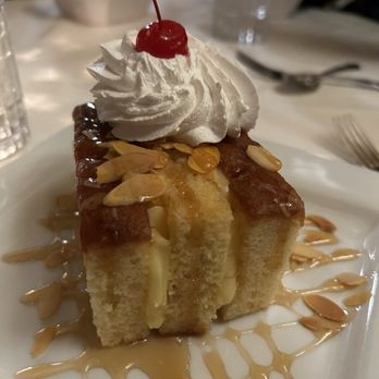 Golden Mast Inn - Bienenstich - "Bee Sting Cake" - yellow custard cake, Bavarian cream, honey, and almonds. - Venues & Event Spaces Near Me - Okauchee, Wisconsin Golden Mast Inn - Bienenstich - "Bee Sting Cake" - yellow custard cake, Bavarian cream, honey, and almonds. - Venues & Event Spaces Near Me - Okauchee, Wisconsin