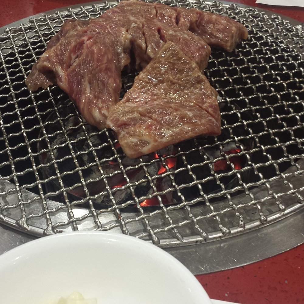 Mapo BBQ - Kalbi being cooked over charcoal grill. Yumm - Korean Near Me - Flushing, New York Mapo BBQ - Kalbi being cooked over charcoal grill. Yumm - Korean Near Me - Flushing, New York