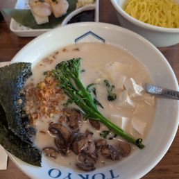 Creamy vegan ramen with a side of extra noodles. Husband's sushi in the background.