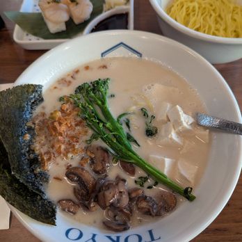 RAKKAN Ramen - Anaheim GardenWalk - Creamy vegan ramen with a side of extra noodles. Husband's sushi in the background. - Ramen Near Me - Anaheim, California