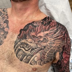 Red Buddha Tattoo - Dragon 
Artist: Ryback