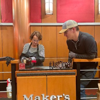 Maker's Mark Distillery - My wife hand dipping the bottle of Maker's Mark she bought me - Tours Near Me - Loretto, Kentucky