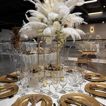 Cielo Party Decor & Rental - Table setting with gold chargers, taupe table napkins, talk centerpieces - Party & Event Planning Near Me Cielo Party Decor & Rental - Table setting with gold chargers, taupe table napkins, talk centerpieces - Party & Event Planning Near Me
