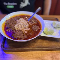 Ruben's Grill + Cantina - Birria Ramen. Comes with limes, onions and cilantro.