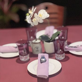 Mulan Fusion - a table setting with purple napkins and white plates - Chinese Near Me - Clark, New Jersey Mulan Fusion - a table setting with purple napkins and white plates - Chinese Near Me - Clark, New Jersey