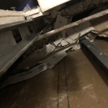 CC Carpet - Debris left in between shower wall and pipes - Carpet Installation Near Me - Richardson, Texas