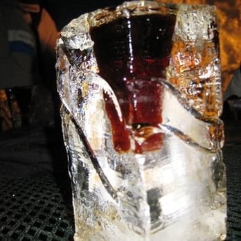 The Ice Bar - a drink in a glass on top of a block of ice - Lounges Near Me - Olympic Valley, California