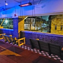 The Bluebird Cocktail Room - Porch swings.