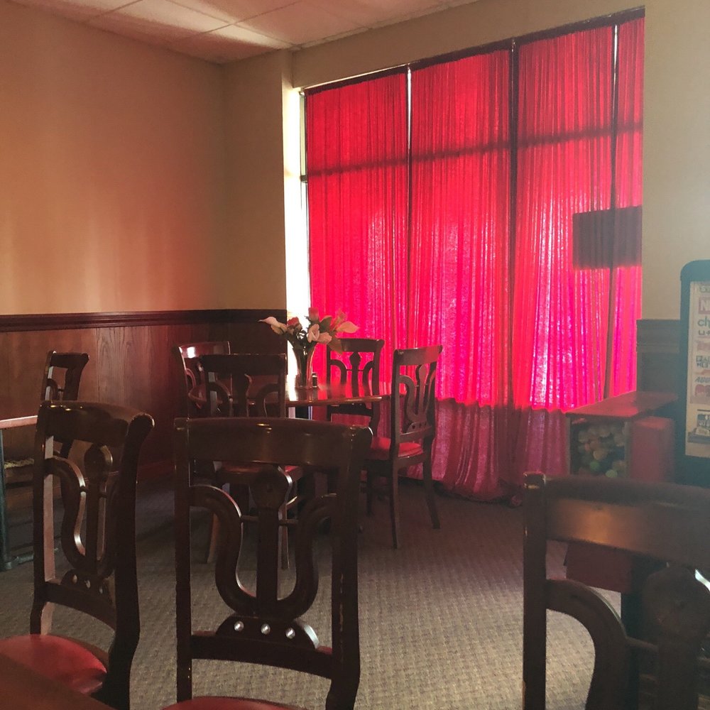 a restaurant with red curtains a restaurant with red curtains