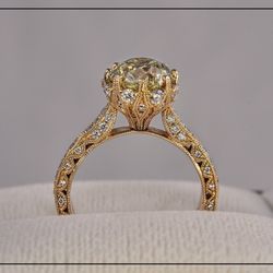Expressions Jewelry - 14K yellow gold ring setting with .70 carat of diamonds from Expressions with customer's own yellow diamond.
