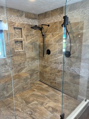 Master bath renovation - This custom tiled wet room (10' x 5') and double vanity encompass a soaking tub, 5'stainless linear drain, freestanding faucet, double head shower, bench and niche. Master bath renovation - This custom tiled wet room (10' x 5') and double vanity encompass a soaking tub, 5'stainless linear drain, freestanding faucet, double head shower, bench and niche.