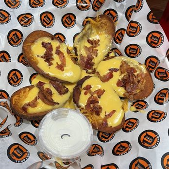 Detroit Coney Grill - Potato skins with bacon cheese and dipping sauce. - Sports Bars Near Me - Gilbert, Arizona Detroit Coney Grill - Potato skins with bacon cheese and dipping sauce. - Sports Bars Near Me - Gilbert, Arizona